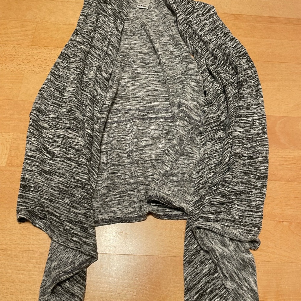 Used sweater vest/wrap black and white made by papaya size large